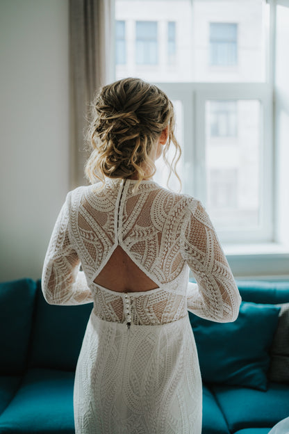 lace wedding dress from the back with a cutout