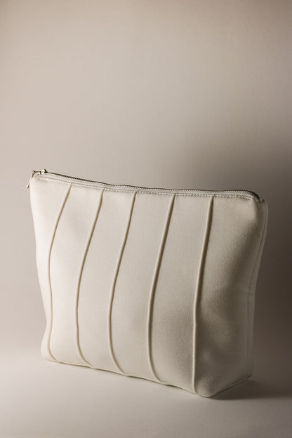 white feminine cosmetic bag