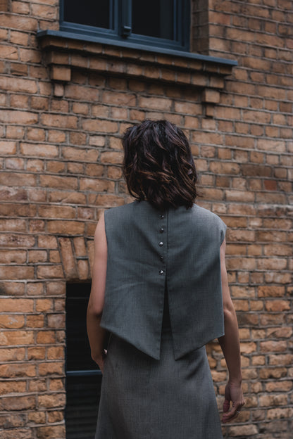 picture of the back of the dress, mostly the top part - a dress with fine and shiny rivets