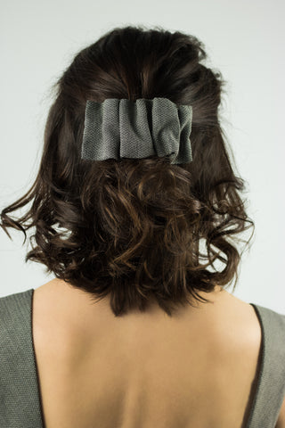 gray hair clip pinned in the hair