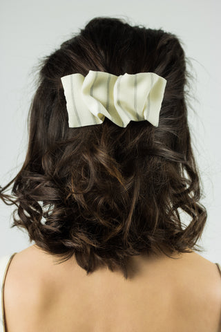 ecru white hair clip pinned in the hair